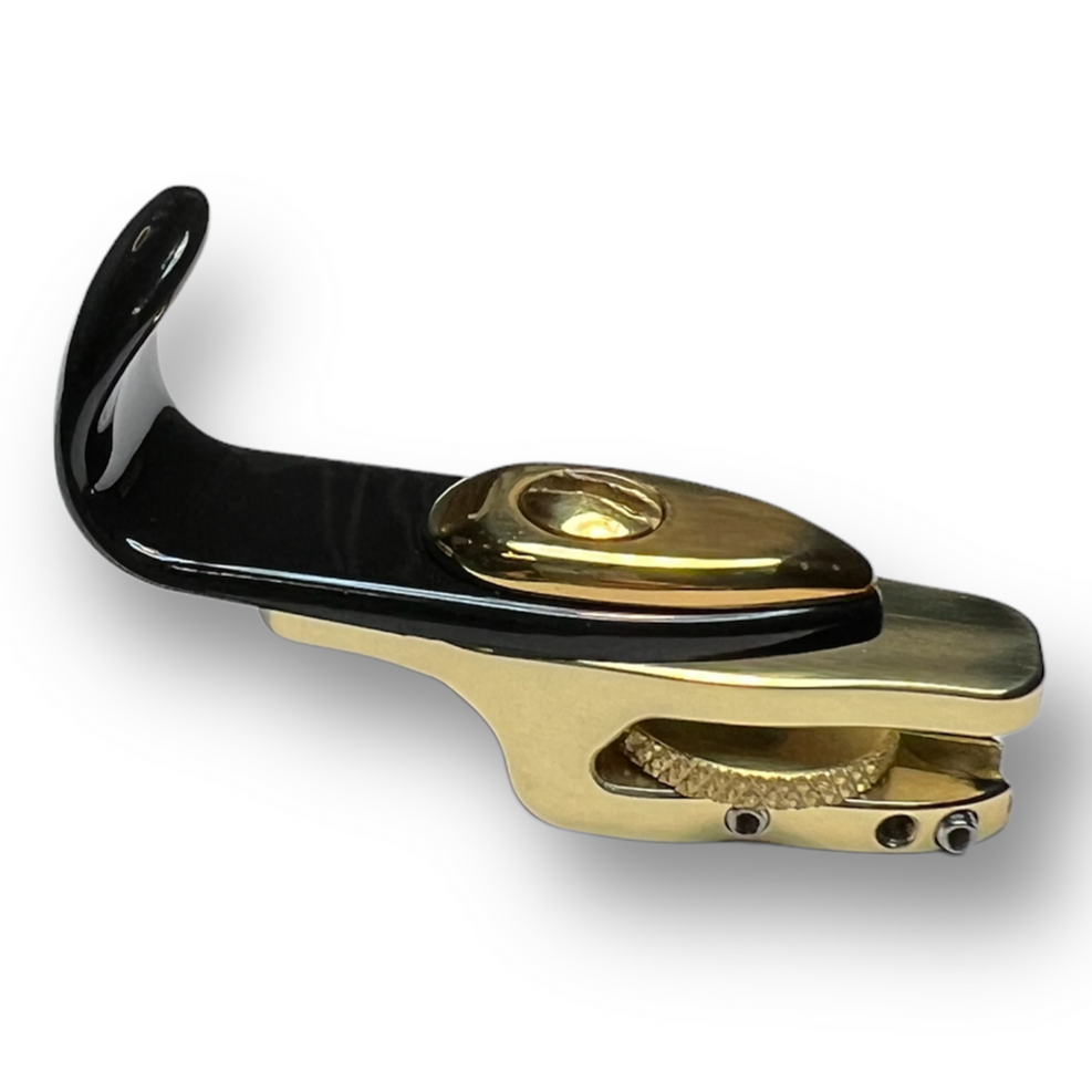 A plastic saxophone thumb hook used with the LAGAN wrist saver for saxophone. It helps expand the right hand grip and allow for greater adjustability of your right thumb hook or right thumb rest.