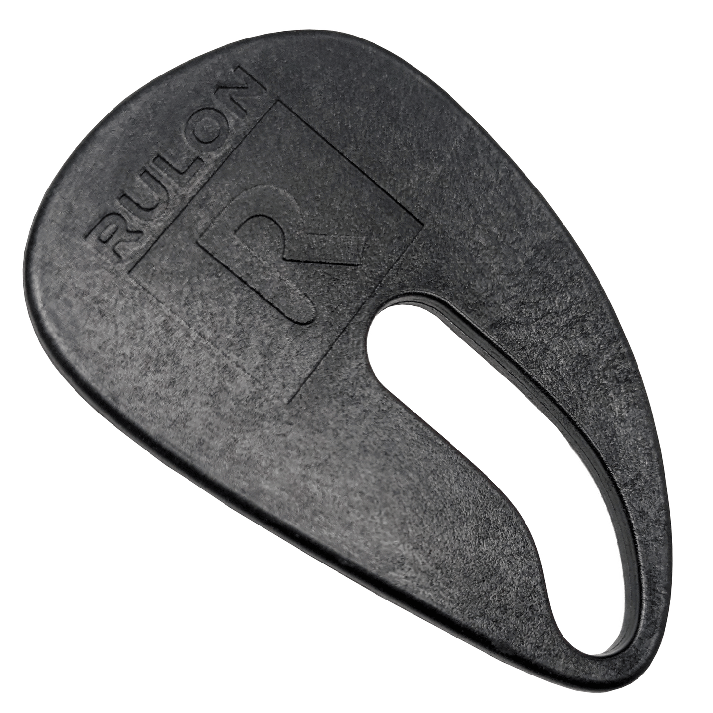A black plastic RULON saxophone thumb rest to reduce pain and discomfort while playing saxophone.