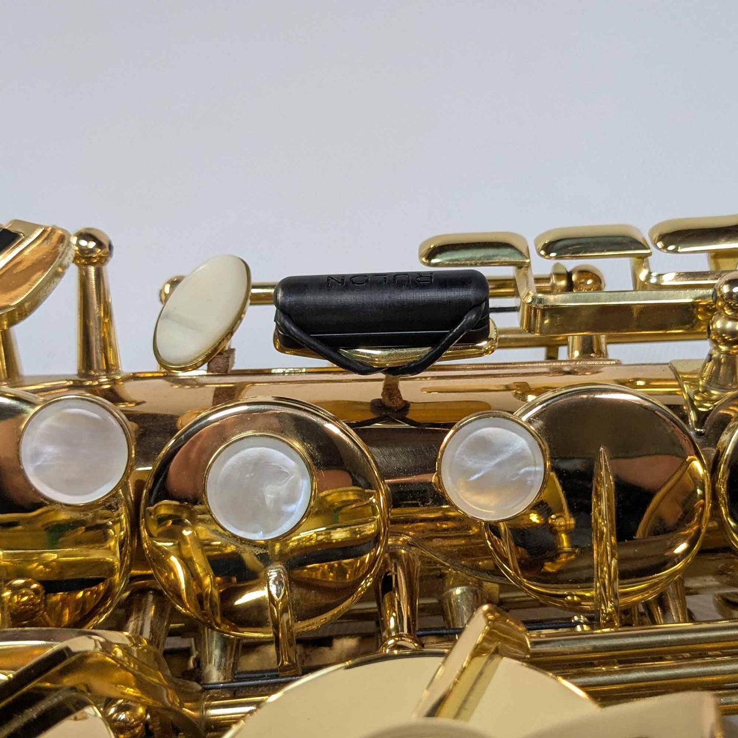 Side view of RULON Saxophone Key Booster for High F Sharp.