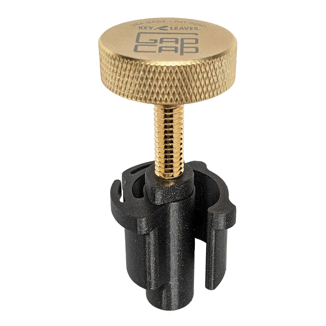 A gold plated GapCap® saxophone end plug that helps protect the octave key and sax body from damage inside the case.
