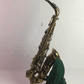 Gif of silk hodge swab pulling through an alto saxophone to dry the inside and keep the pads clean and dry without sticking to tone holes