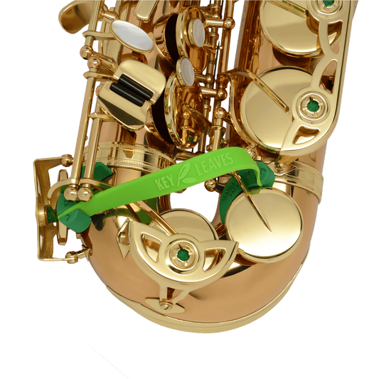 Green Key Leaves saxophone key props shown on a bronze body brass alto saxophone to stop and cure sticking G#, Eb, Low C# pads. The best way to fix sticking sax pads. 