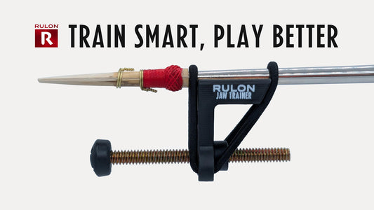 A photo of a RULON Jaw Trainers installed on a Bassoon bocal near the reed.