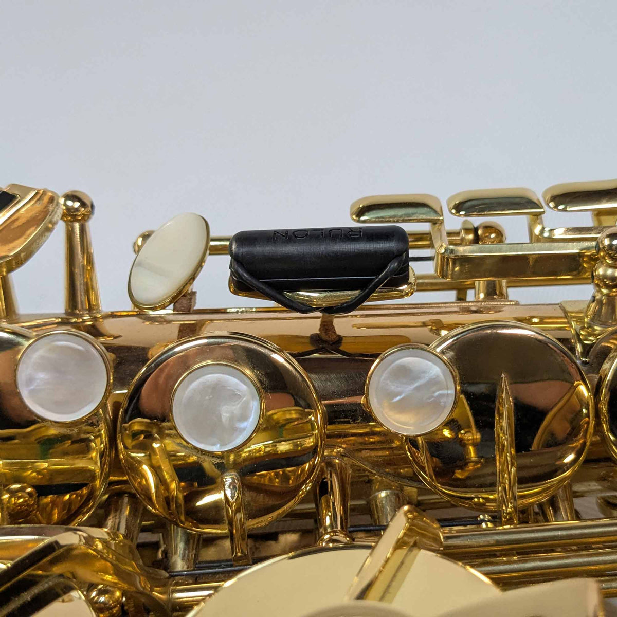 Side view of RULON Saxophone Key Booster for High F Sharp.