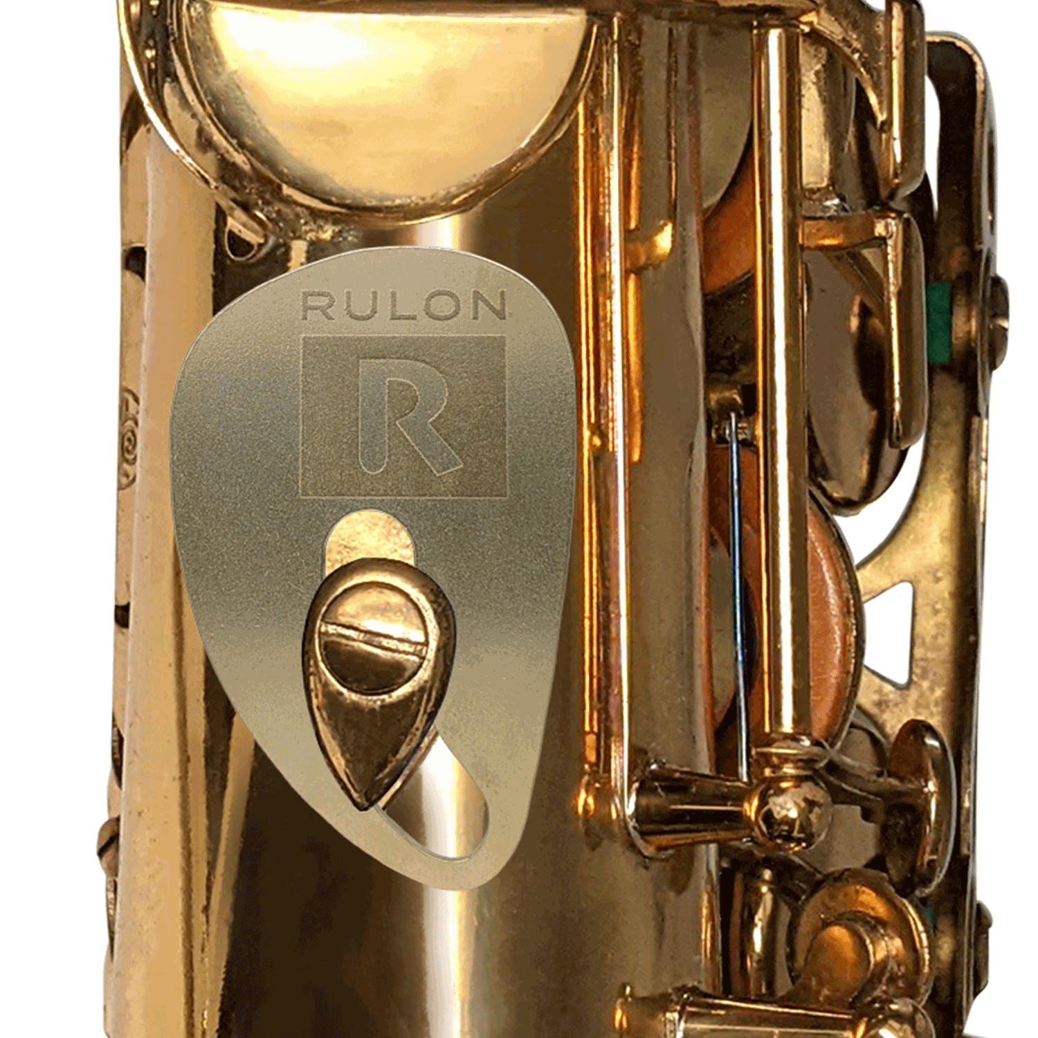 A RULON Saxophone Rest made from tumbled raw brass shown mounted to a tenor saxophone thumb hook screw.