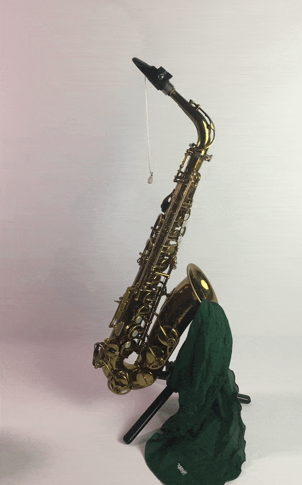 Gif of silk hodge swab pulling through an alto saxophone to dry the inside and keep the pads clean and dry without sticking to tone holes